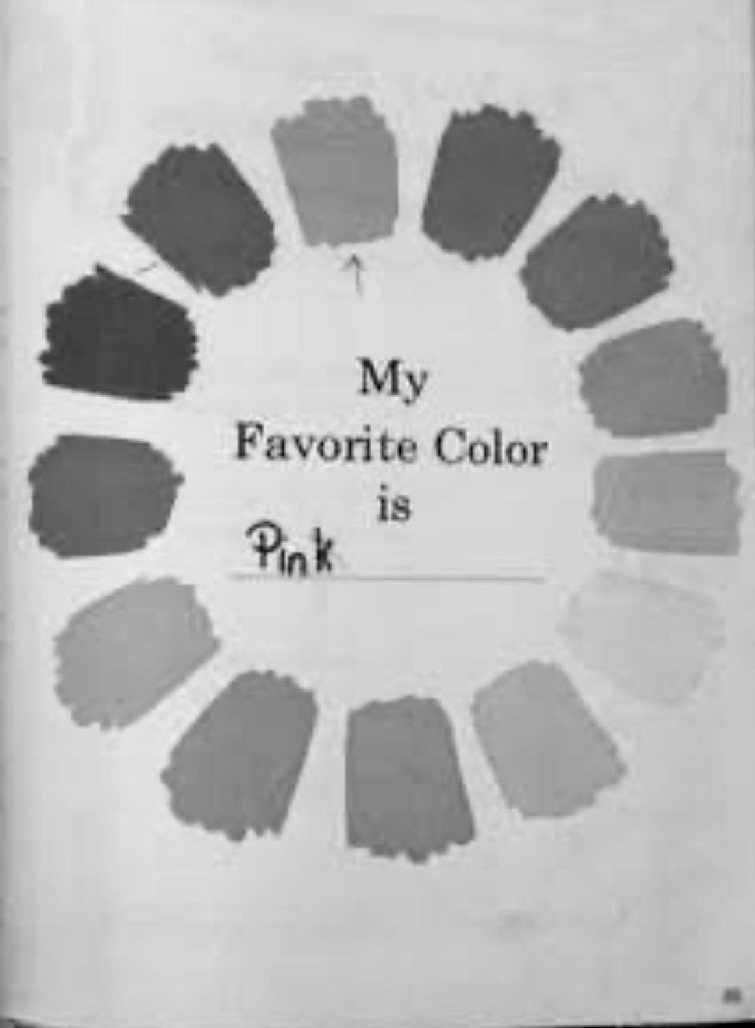 A page from a children's colour book: a ring of hand-painted colour chips around the printed words My Favorite Color is, with Pink written in on the line in a child's hand.